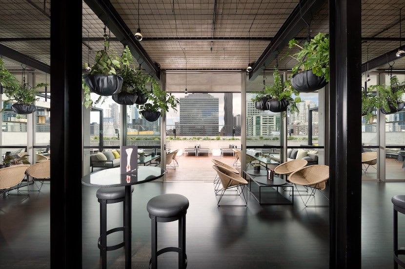 Take a seat staring out at Melbourne's skyline at the newly opened Rooftop at QT. Image courtesy of QT Melbourne.