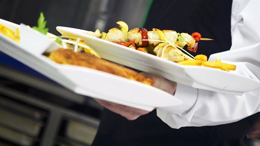 male chef presenting food