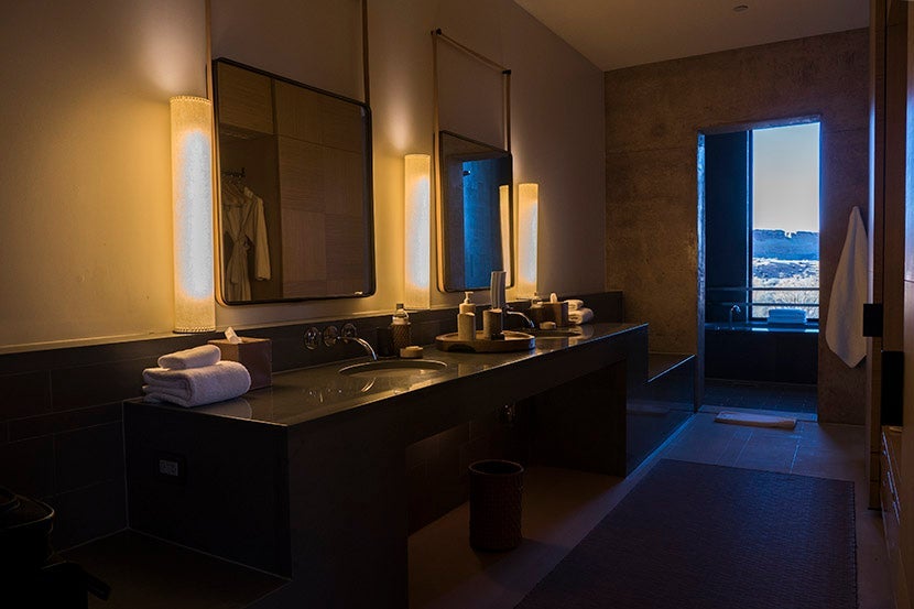 Large vanity area with his-and-hers sinks and gowns.