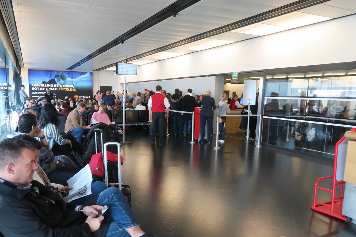Austrian Airlines agents segregated passengers between business and economy when checking passports.