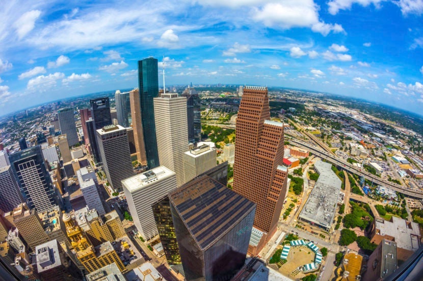 aerial of modern buildings in downtown Houston in daytimeMeinzahn via Getty Images.
