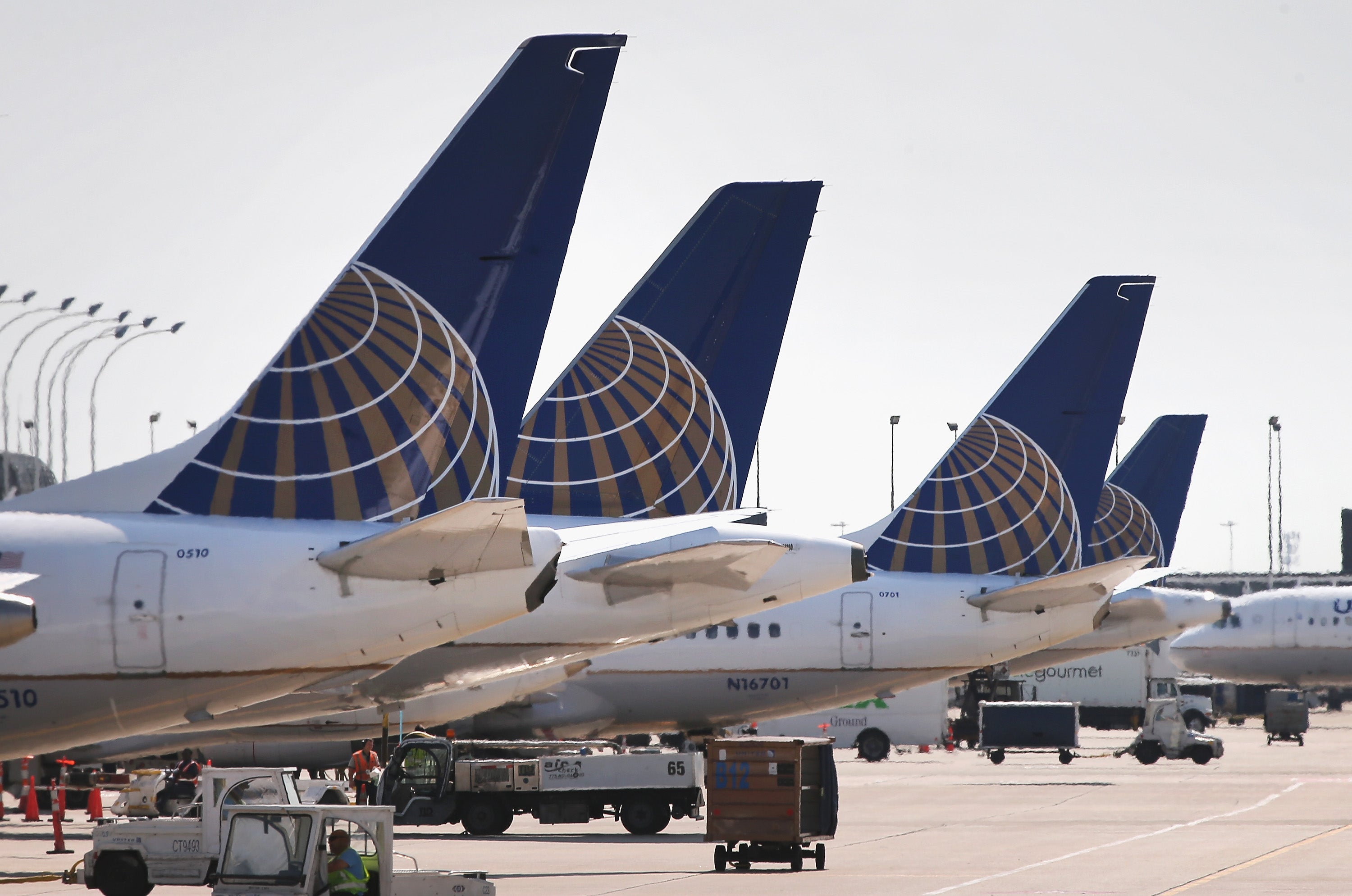 CHICAGO, IL - SEPTEMBER 19: United Airlines jets sit at gates at O'Hare International Airport on September 19, 2014 in Chicago, Illinois. In 2013, 67 million passengers passed through O'Hare, another 20 million passed through Chicago's Midway Airport, and the two airports combined moved more than 1.4 million tons of air cargo. (Photo by Scott Olson/Getty Images)