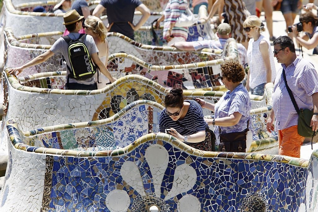 Parc Guell is gorgeous, but crowded. Buy your ticket ahead of time and at dusk to avoid crowds. Image courtesy of Quique Garcia via Getty Images.