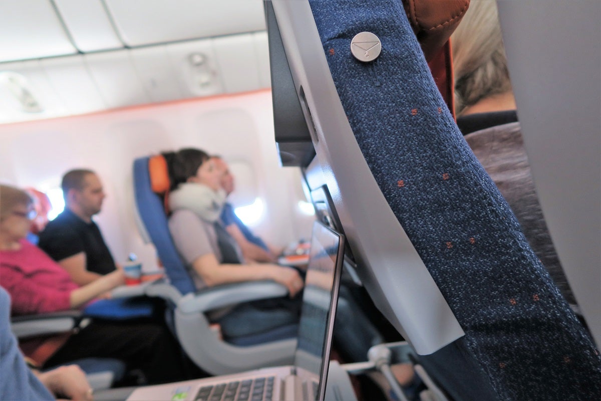 Aeroflot 77W traytable extended and IFE screen tilted