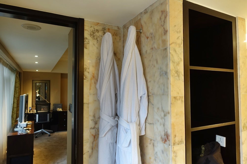 Bathrobes, hair dryer and an inconvenient place for a plug.