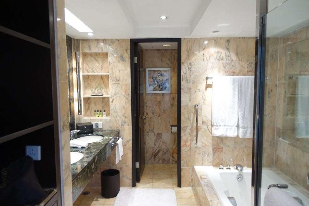 Walking into the bathroom.