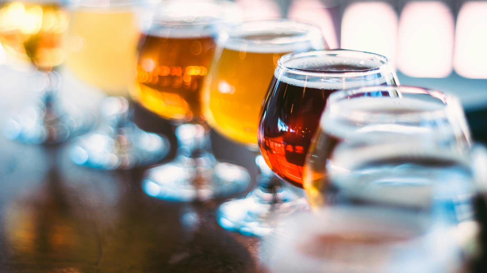 Various Beers In Wineglass On Table