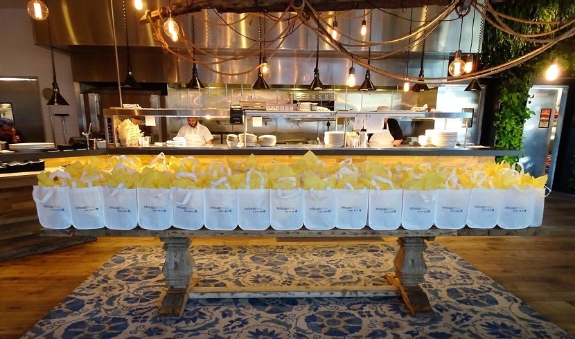 Gift bags await while cooks prepare the night's meal.