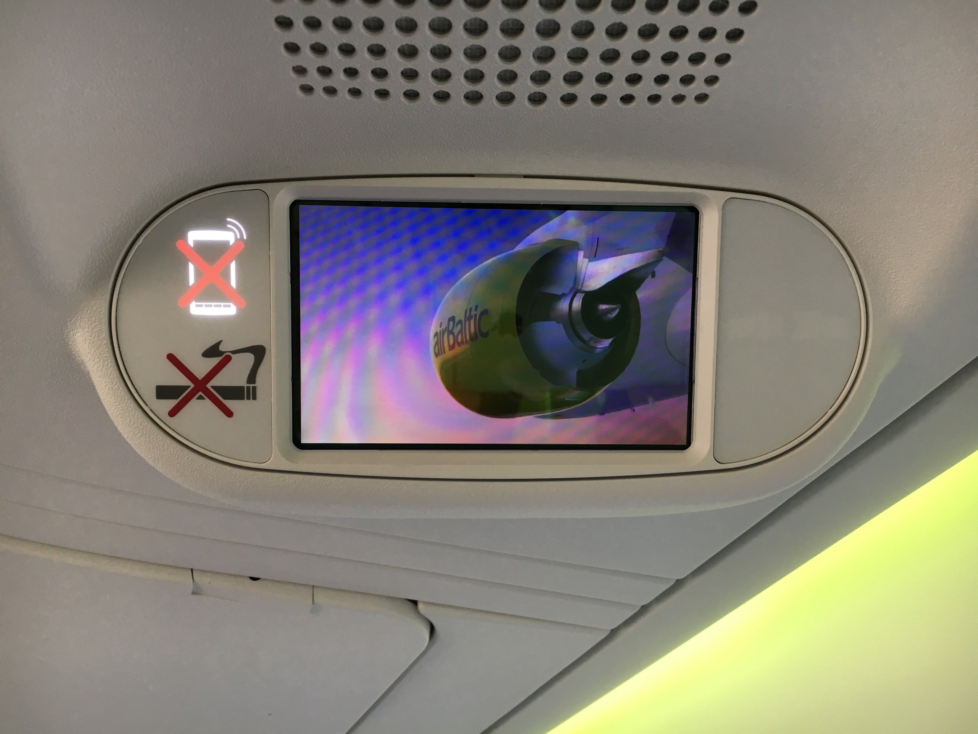 The small screens over each row can be used for safety videos or inflight entertainment.