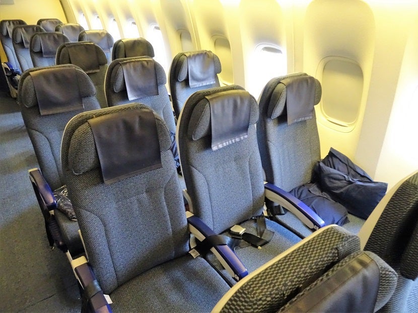 In the back, only two seats on the window. Otherwise, three apiece.