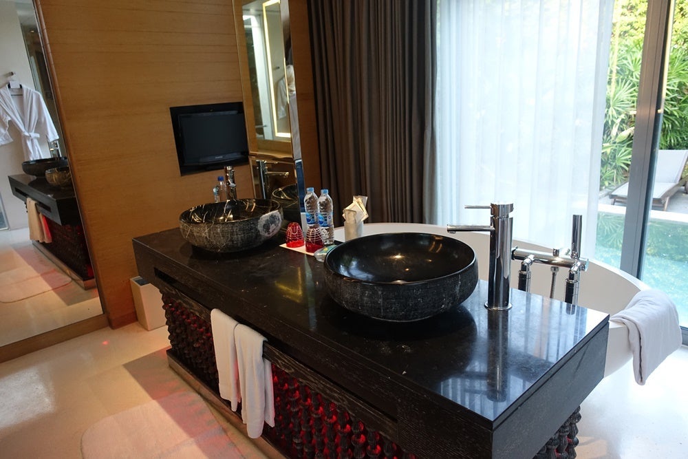 The sink and tub with TV.