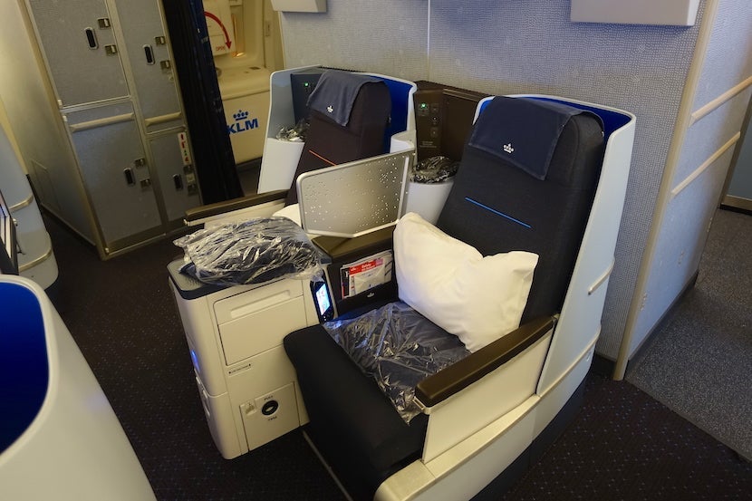 Center seats in the back row of the main business cabin.