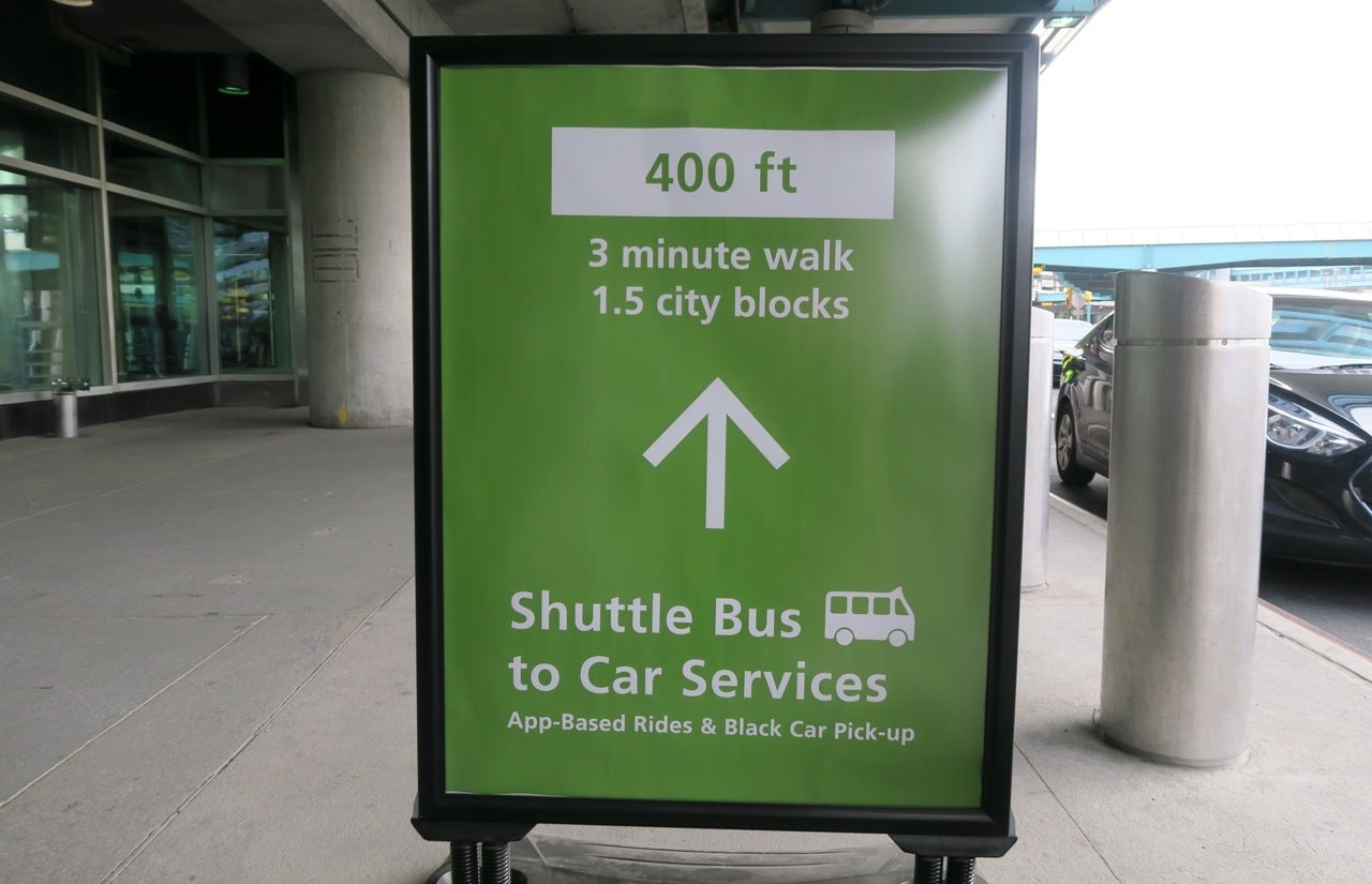 LGA sign to shuttle buses
