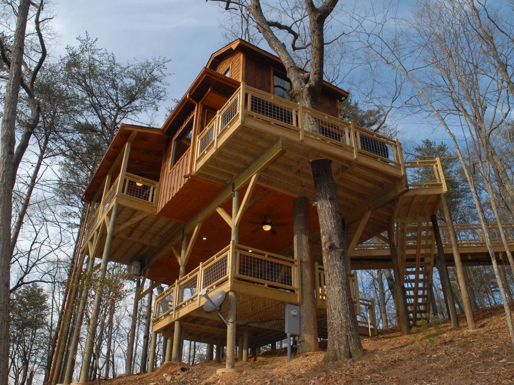 This massive tree house is partially supported by multiple living trees. Photo courtesy of VRBO.