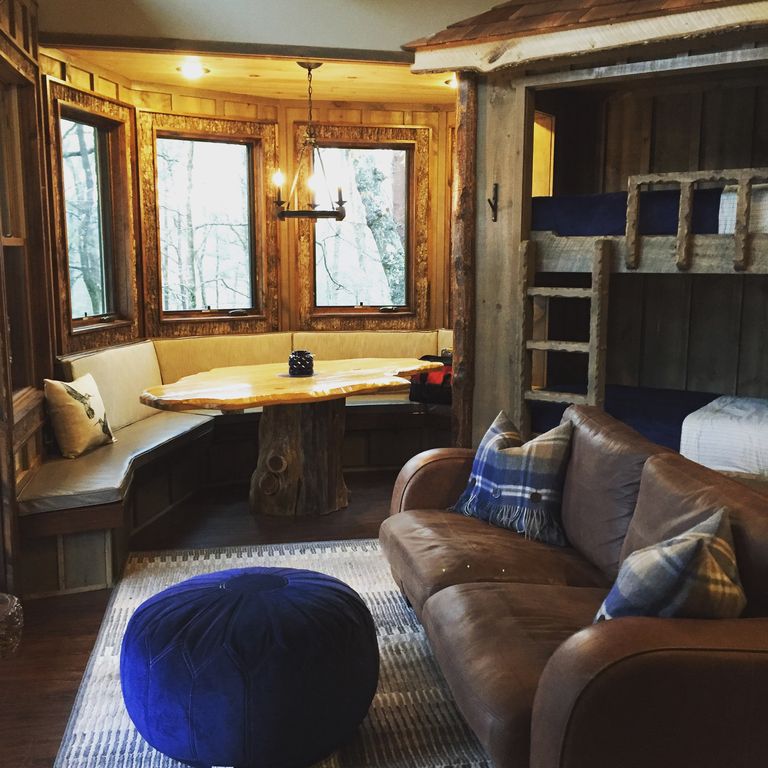 The interior of the house has modern furniture and a cozy feel. Image courtesy of Home Away.