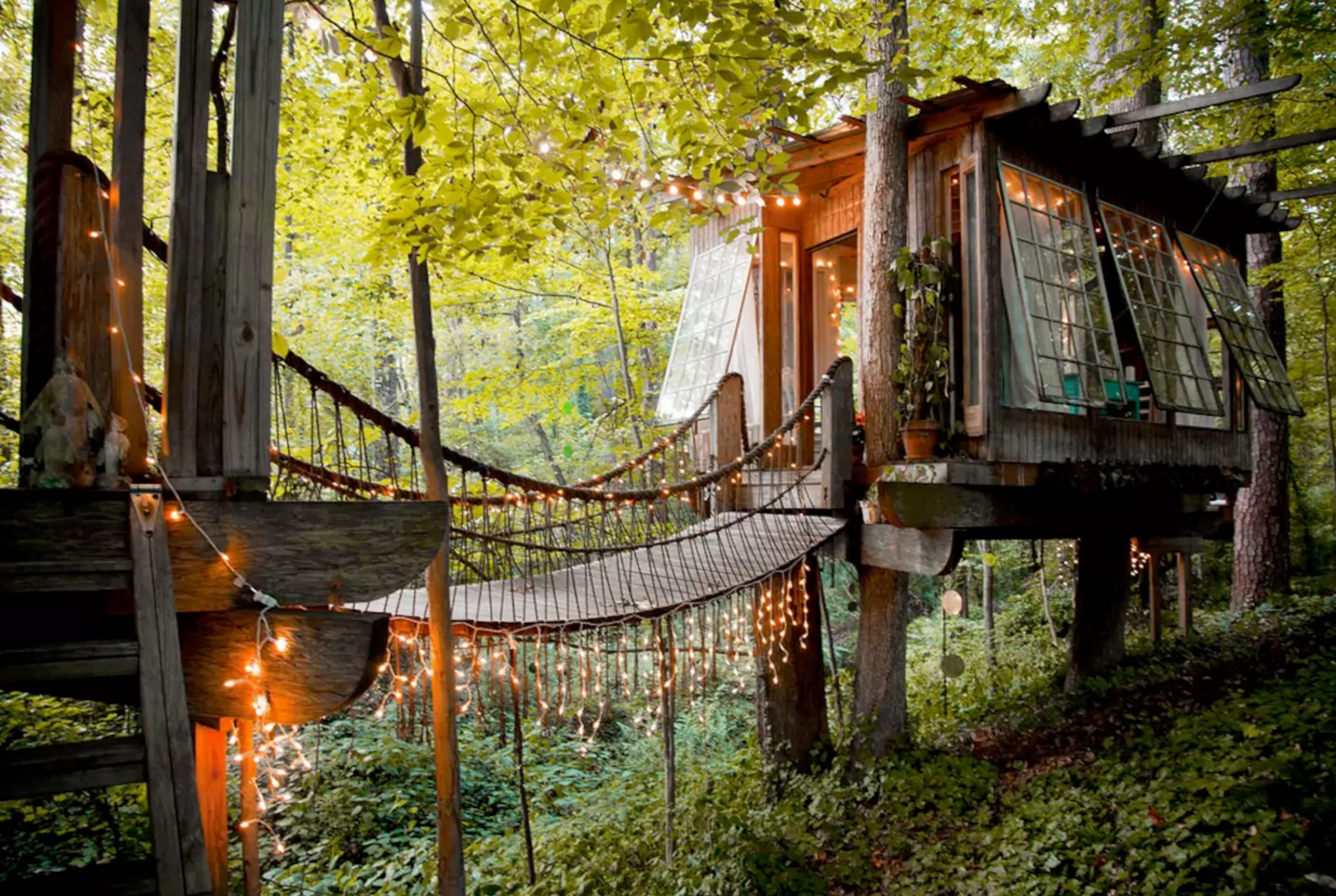A charming bridge between rooms gives this tree house a magical feel. Photo courtesy of Airbnb.