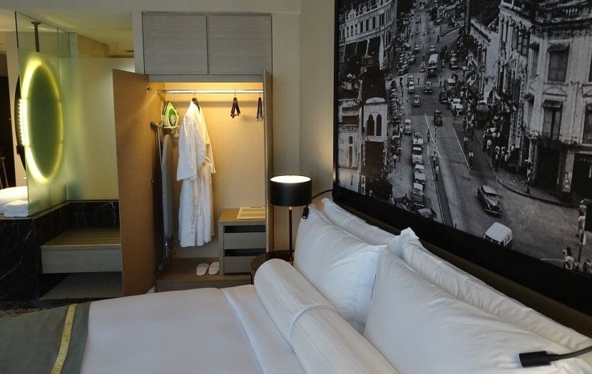 The closet and lighted mirror across from the bed.