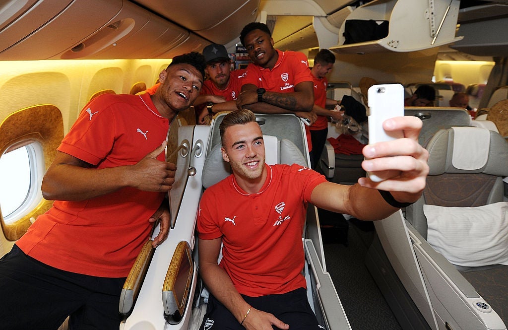 Taking selfies for personal memories seems to be okay on airplanes. Image of Aresenal courtesy of Stuart MacFarlane via Getty Images.