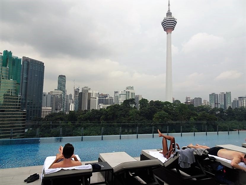 Guests enjoy the view from the rooftop pool.
