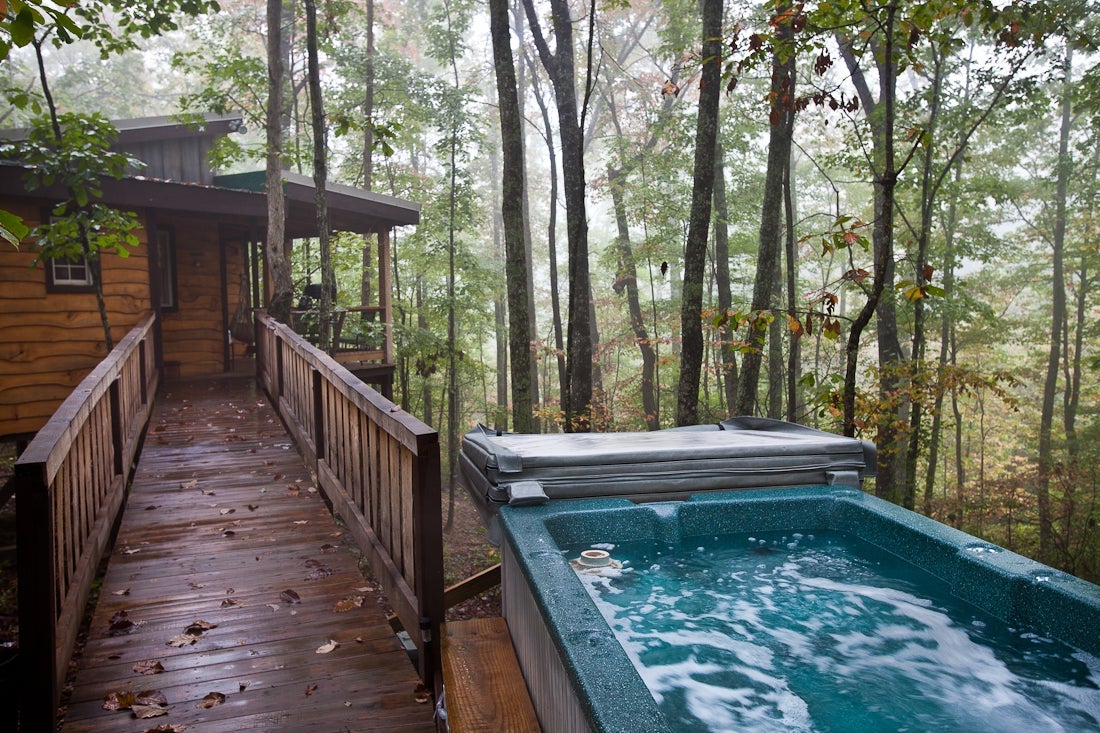 The deck holds a 4 person hot tub and swinging chair for relaxation. Photo courtesy of Sheila Tjelmeland.