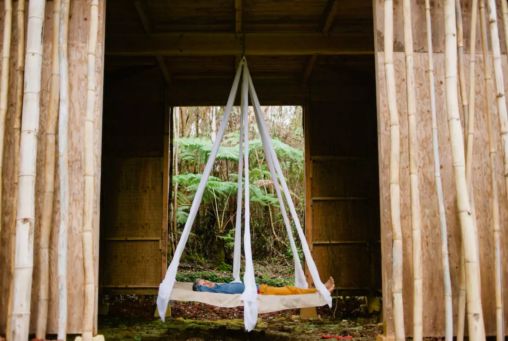 A swinging bed is located on the ground floor beneath the loft bedroom. Photo courtesy of Airbnb.