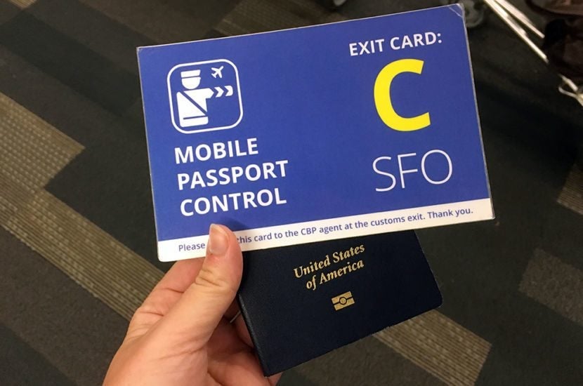 person holds mobile passport card