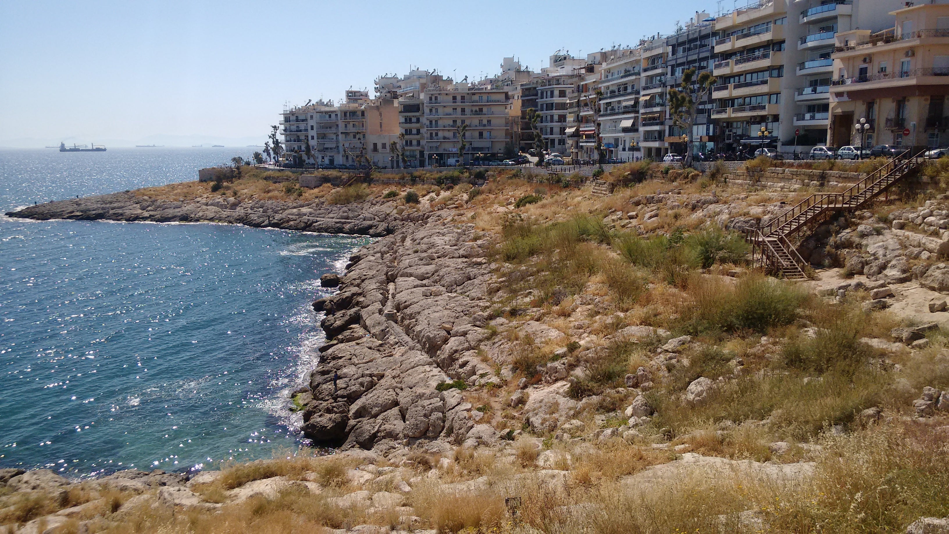 Piraeus was historically home to the Athenian navy. In some sections, as above you can see ruins of ancient fortifications.
