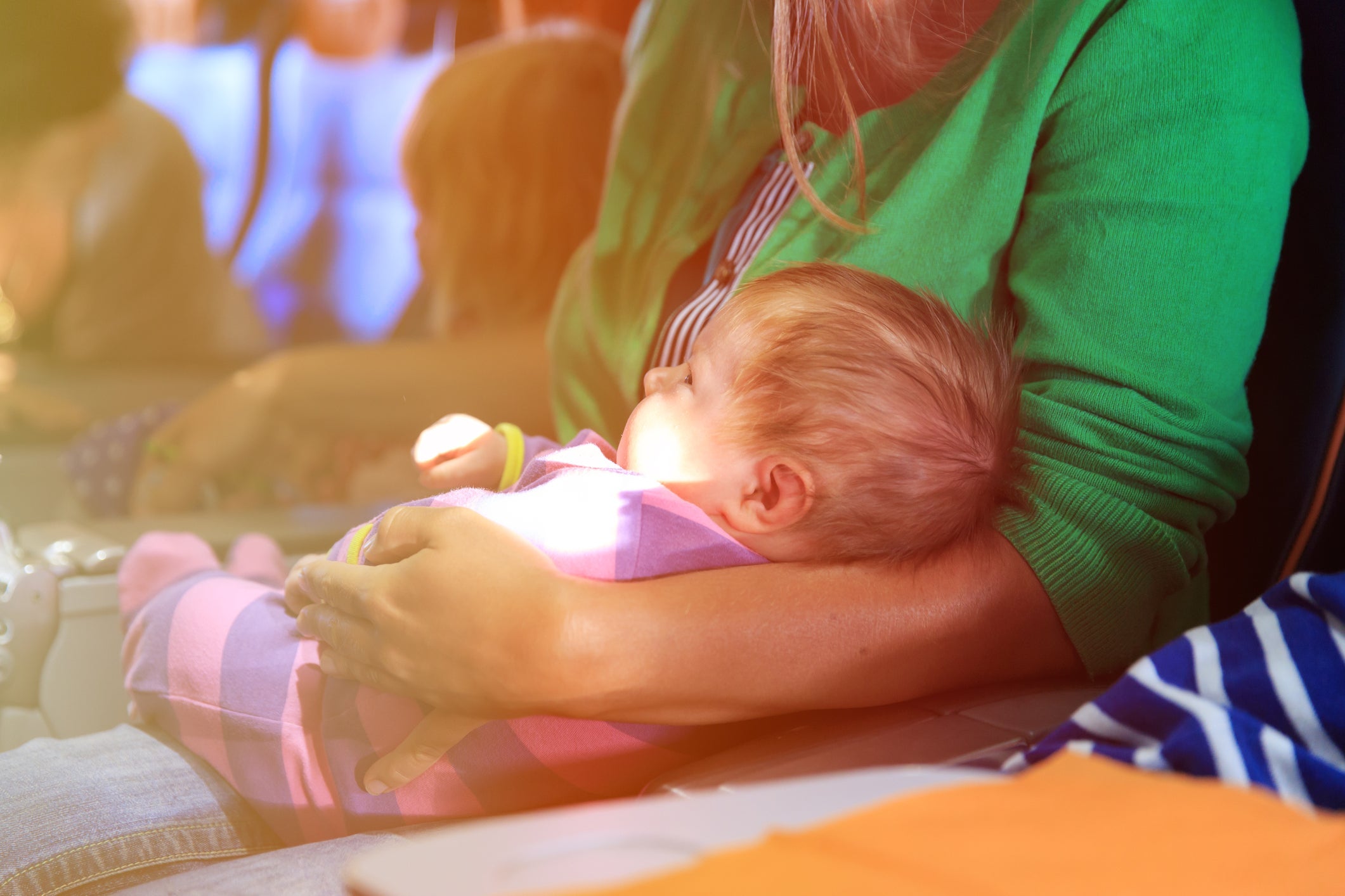 mother and infant daughter travel by plane