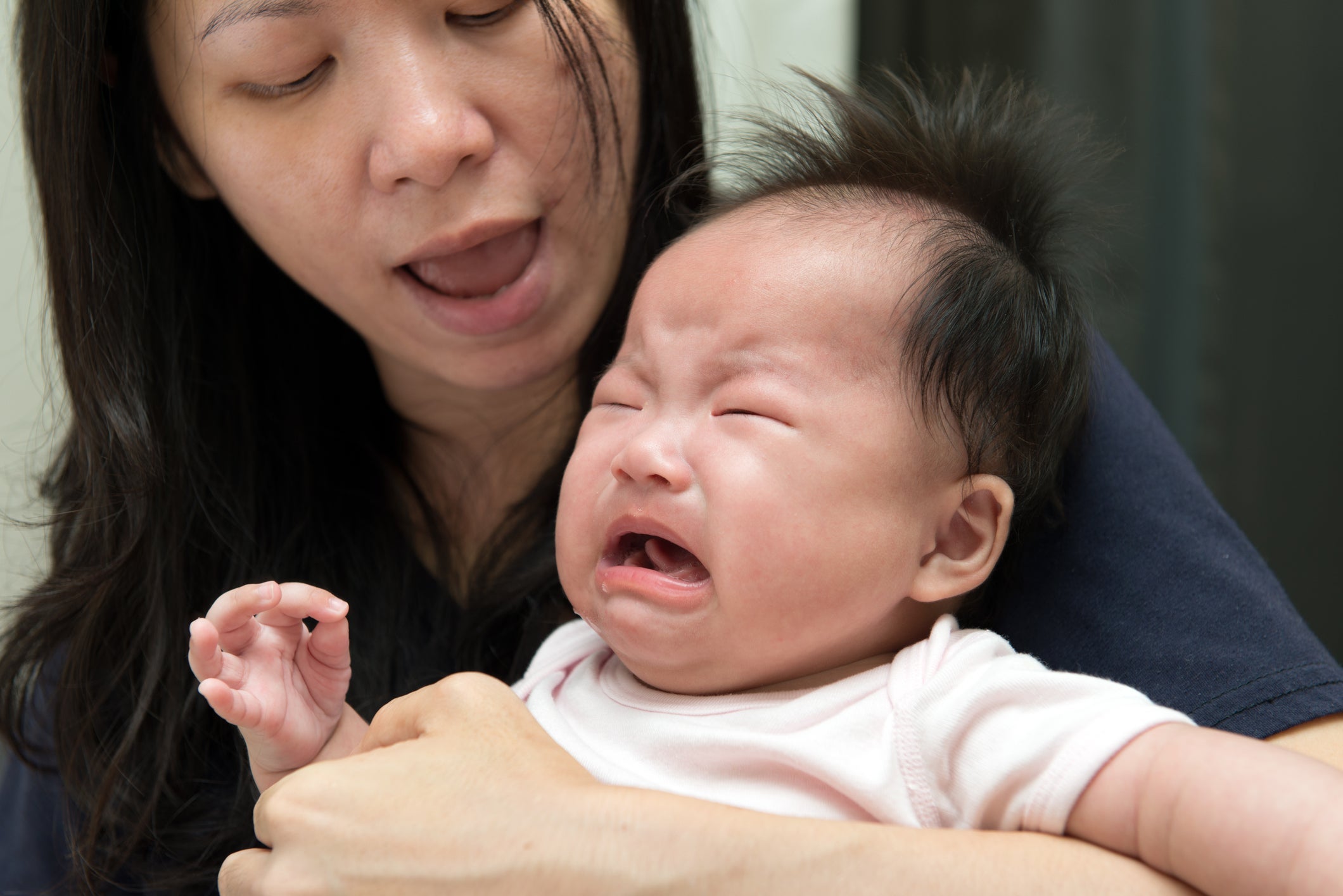 The people most frustrated by crying babies on board? Their parents. Image courtesy of Kenishirotie via Getty Images.
