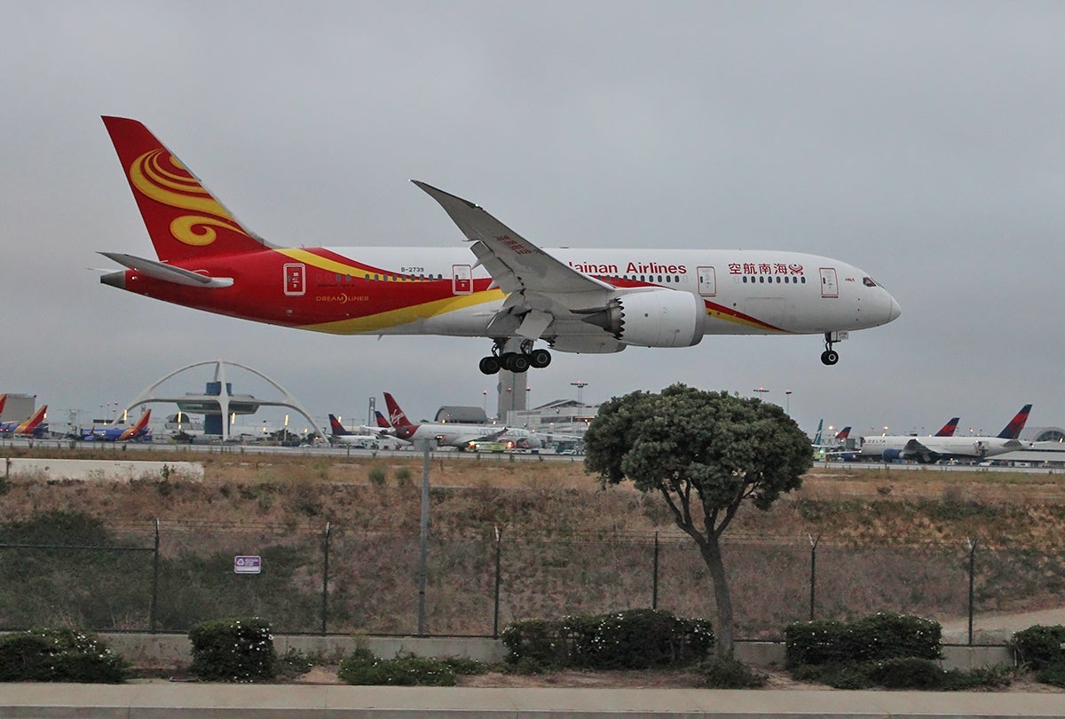 A Boeing 787 lands at LAX. Too bad the day was cloudy; I had managed to find an excellent picture spot.