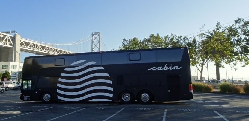The Cabin bus lets passengers off in San Francisco at a parking lot near the Bay Bridge.