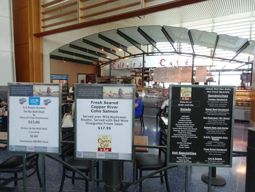 Capers Cafe Le Bar advertises its specialties.