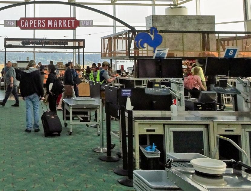 Once you pass through the TSA checkpoint at PDX, it's easy to spot Capers Market.