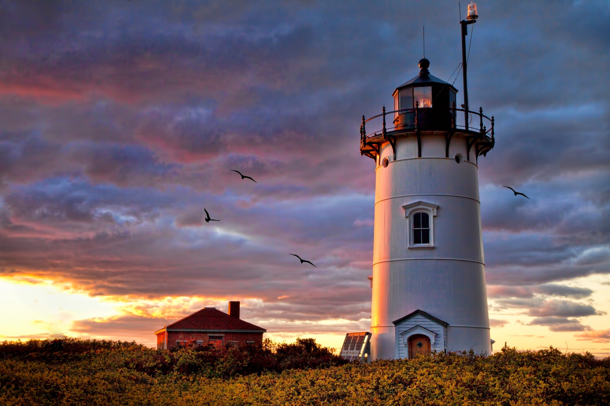 Clearing storm and dramatic skies at Race Point Lighthouse on Cape Cod.