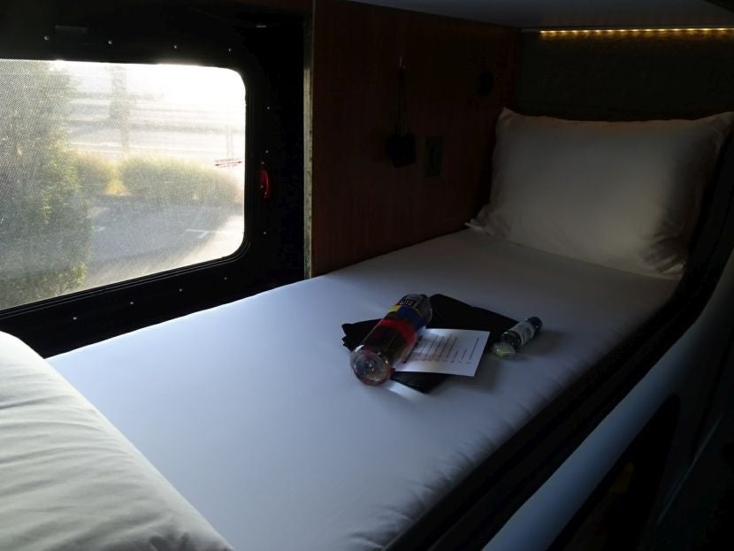 An unused sleep pod awaits the next passenger.