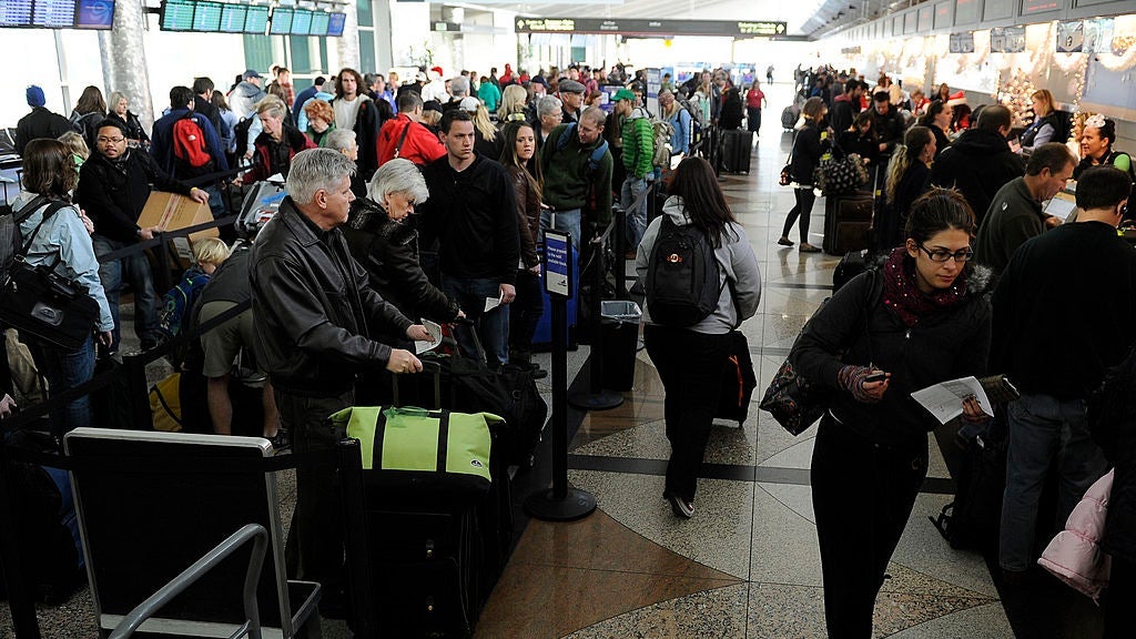 Holiday travelers make their way through a busy Southwest Airline check in, Wednesday, December 21, 2011, at Denver International Airport. Between today and next Monday DIA will see over a million travelers. The Kobernusz family, from Denver, are heading