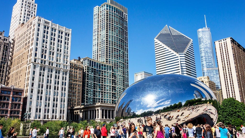 Millennium Park, Cloud Gate The Bean, public art with reflection of the distorted city skyline.