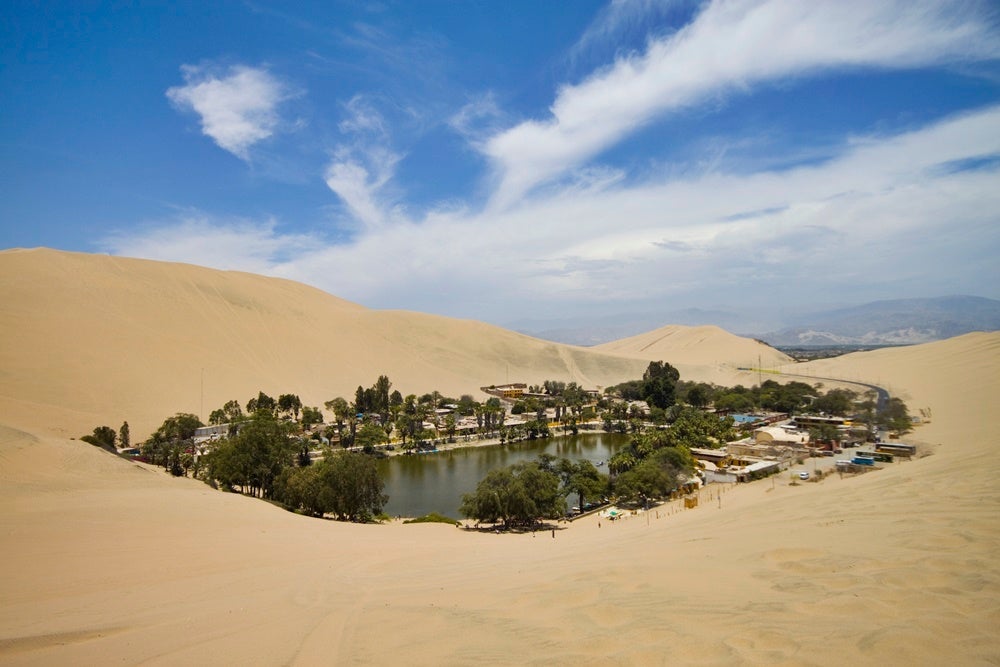 The desert oasis of Huacachina. Image by craigchiassonphotography / Getty.