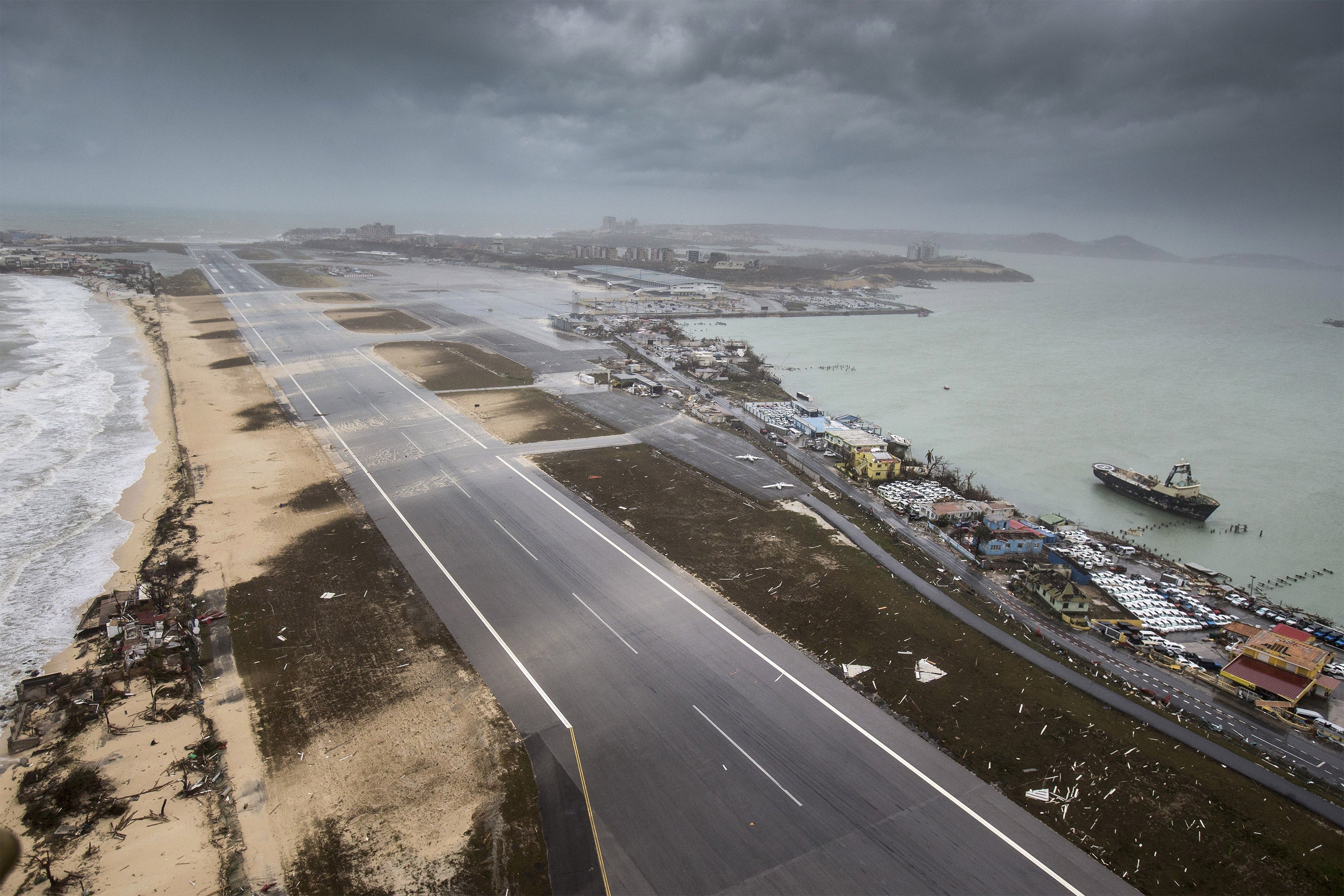 An aerial photography taken and released by the Dutch department of Defense on September 6, 2017 shows the damage of Hurricane Irma on the Princess Juliana International Airport and Simpson Bay Beach (Image by Gerben van Es / ADP / Getty Images)