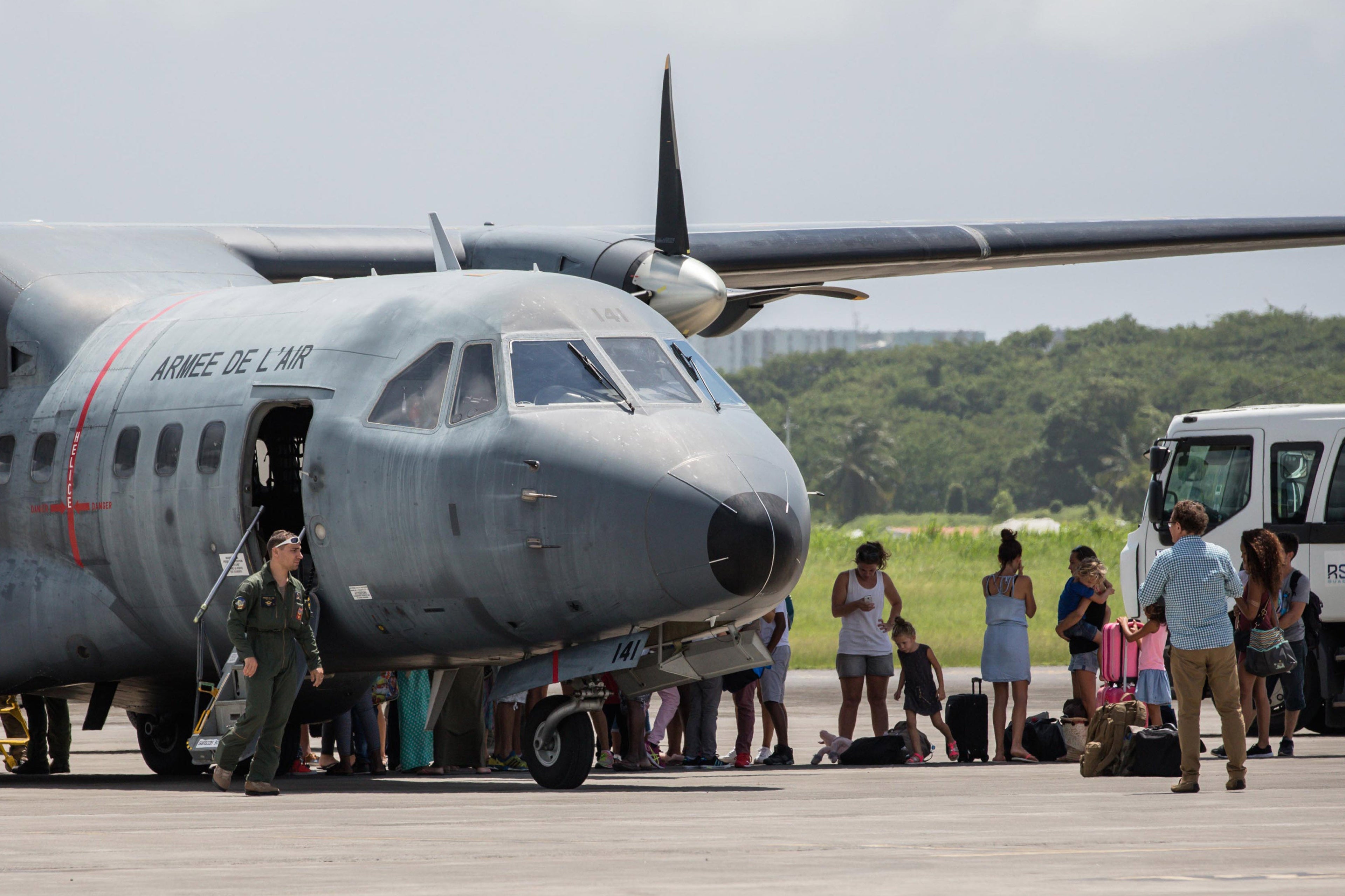 Civilians evacuated from Saint Martin to Pointe-à-Pitre airport after the passage of Hurricane Irma arrive on September 10, 2017 (Photo by Aurelien Morissard/IP3/Getty Images)