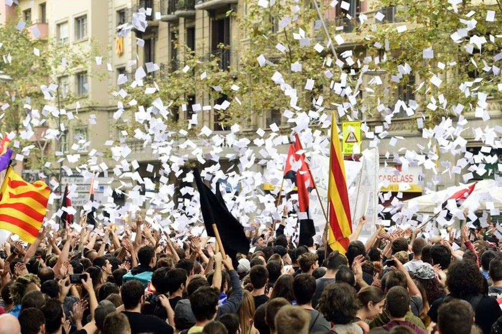 Protesters in Catalonia on October 3, 2017. Image by PIERRE-PHILIPPE MARCOU / Getty Images.