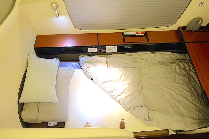 JAL first class bed overhead