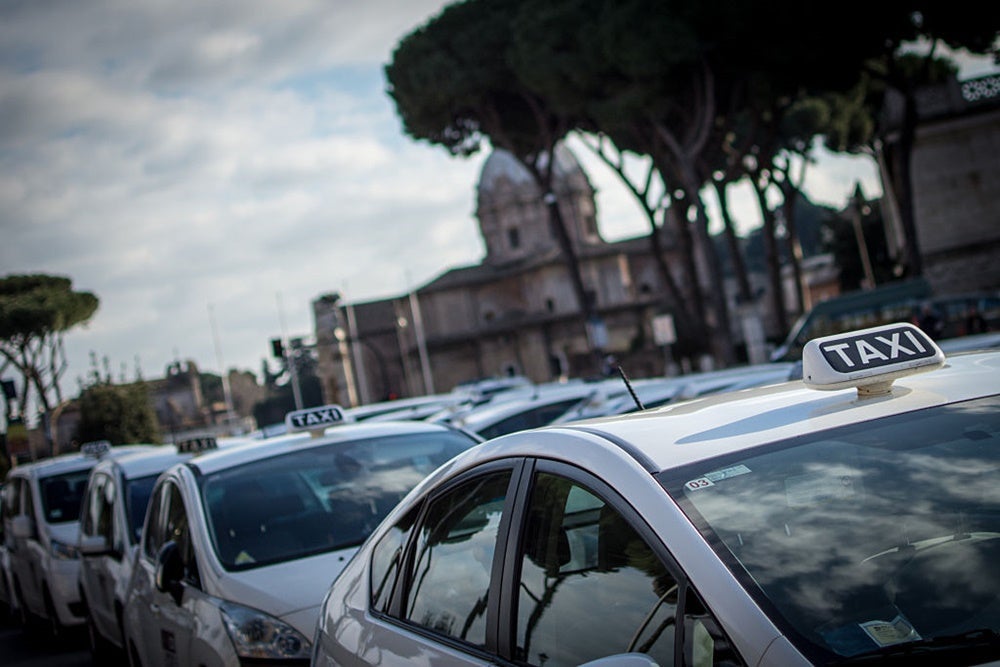 Taxis are widely available in Rome. Image by Andrea Ronchini/Pacific Press/LightRocket via Getty Images.