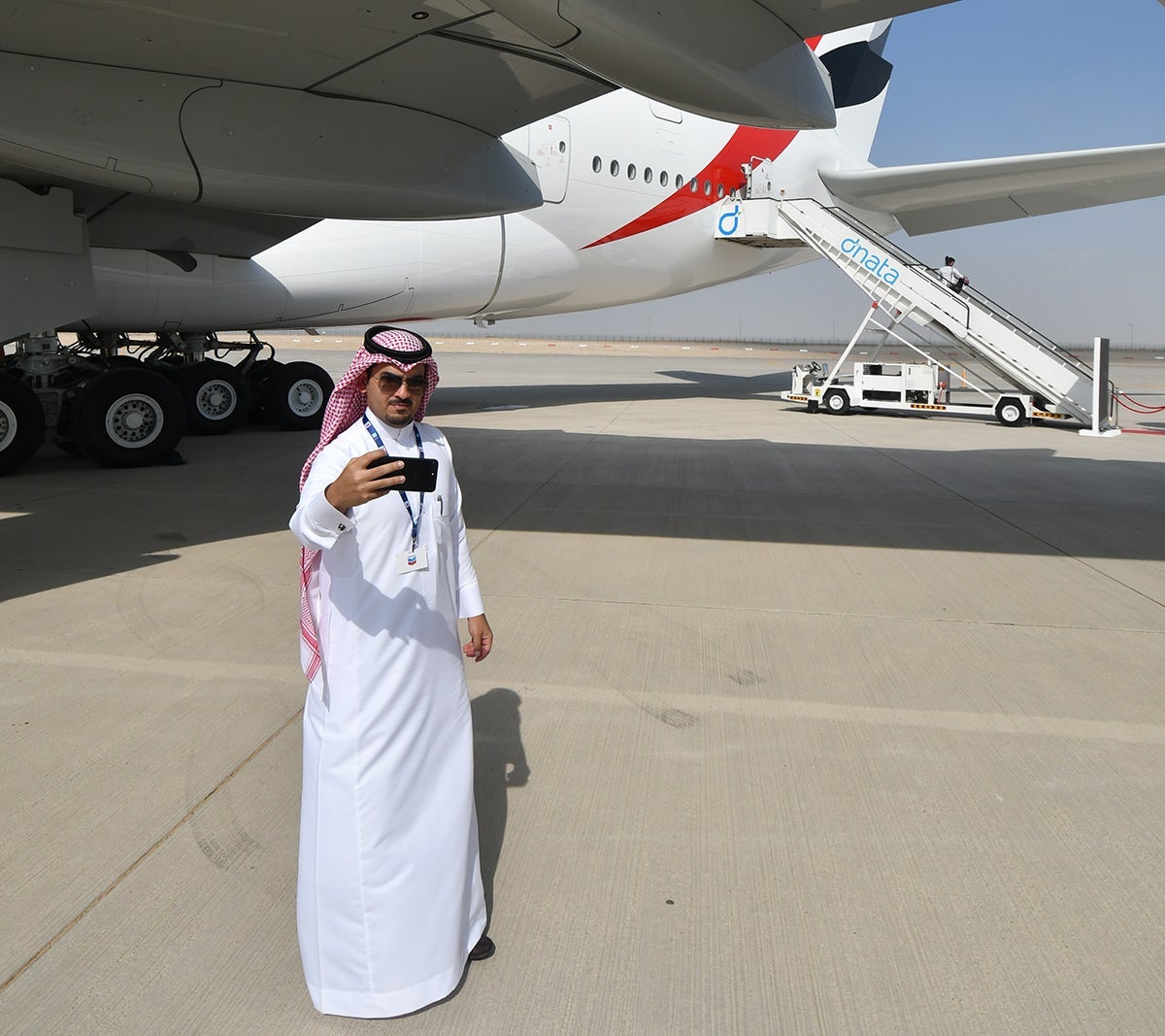 Under the wing of the 100th A380 in the Emirates fleet, at the Dubai Air Show. Image by Alberto Riva / The Points Guy