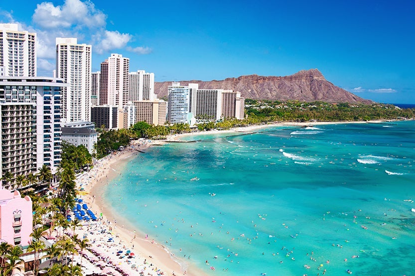 Doesn't Waikiki Beach look great right about now? Photo by M Swiet Productions / Getty Images.