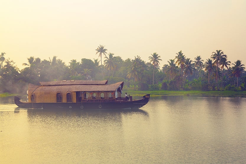 Kerala's backwaters are the perfect place to explore at a slower pace. Image credit: Getty Images.