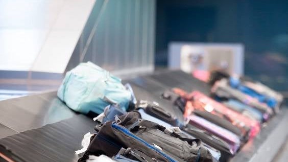 Young man waiting for baggage
