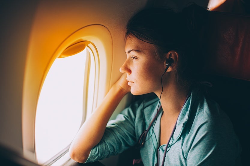 woman,plane,crying,window seat,pensive