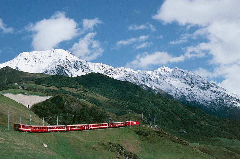 SWITZERLAND - MAY 27: The Glacier Express train of the Rhaetian Railway (UNESCO World Heritage List, 2008), Andermatt, Canton of Uri, Switzerland. (Photo by DeAgostini/Getty Images)