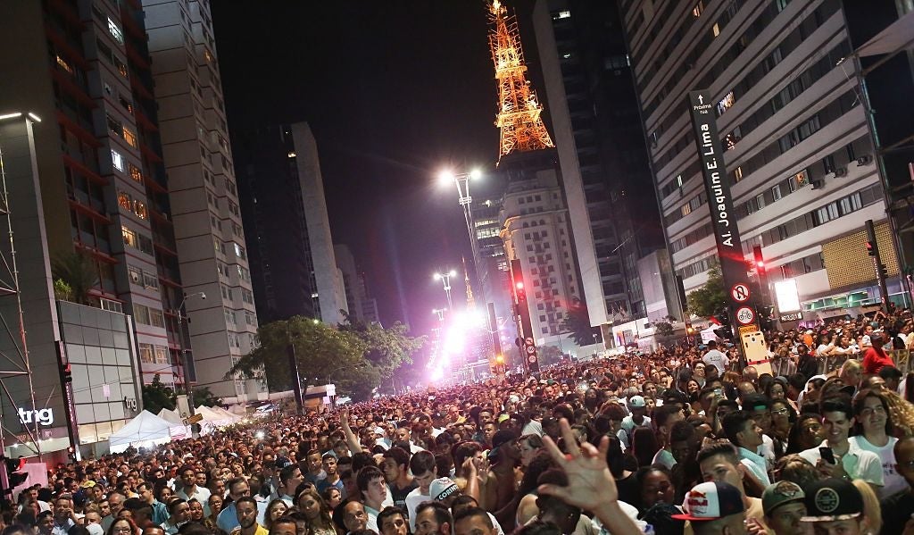 SAO PAULO, BRAZIL - JANUARY 01: Thousands of people gather to watch New Years fireworks and singer Daniela Mercury 's musical shows at Paulista Avenue in Sao Paulo, Brazil on January 01, 2017. (Photo by Dario Oliveira /Anadolu Agency/Getty Images)